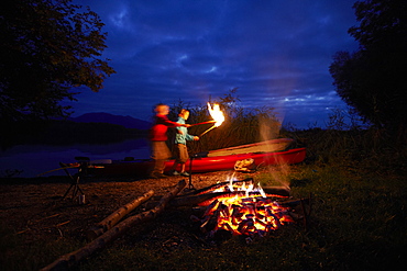 Children at bonfire, lake Staffelsee, Seehausen, Bavaria, Germany