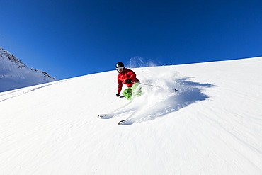 skier in deep powder snow, Zugspitze, Upper Bavaria, Germany