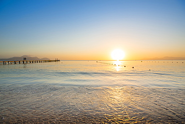 Sunrise on the Mediterranean Sea on the sunny island of Majorca. Playa de Muro beach, Alcudia, Mallorca, Balearic Islands, Spain