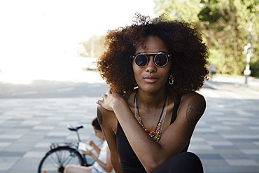 Portrait of a young afro-american woman in urban scenery, Munich, Bavaria, Germany