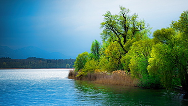 Rain front in front of Fraueninsel, view from the excursion boat, Chiemsee, Germany