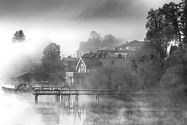 Foggy autumn mood at sunrise on Lake Starnberg, Bavaria, Germany