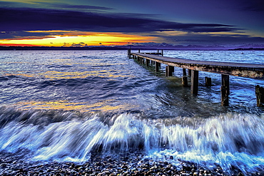 Sunset at Lake Starnberg in bad weather and waves, Bavaria, Germany