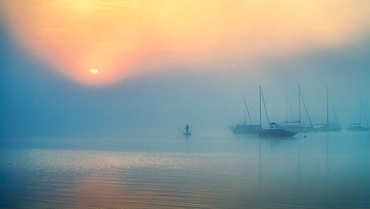 Foggy autumn mood at sunrise on Lake Starnberg, Bavaria, Germany