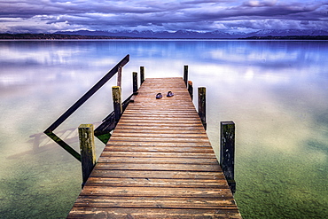 Jetty at sunrise on Lake Starnberg, Bavaria, Germany