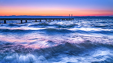 Sunrise during storm at Lake Starnberg, Bavaria, Germany