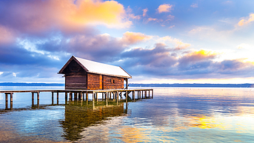 Snow-covered boat hut with jetty, Lake Starnberg, Tutzing, Bavaria, Germany