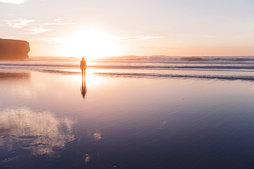 Woman walks on the beach in sunset, Portugal, beach, vacation