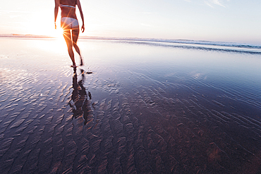 Woman walks on the beach in sunset, Portugal, beach, vacation