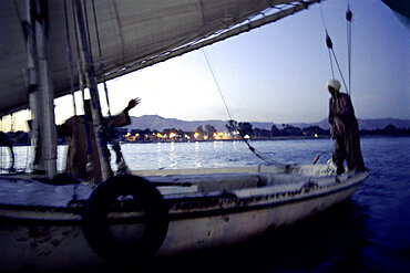 men on a sailing boat, nile, luxor, egypt