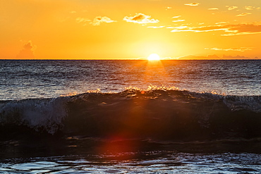 A golden sunset at Ulua Beach with wave, Wailea, Maui, Hawaii, United States of America