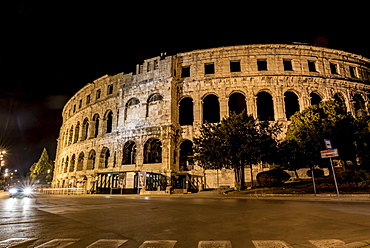 Ancient Roman Amphitheatre known as Pula Arena at night, Pula, Istria, Croatia