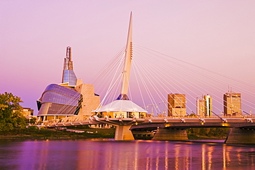 Winnipeg skyline from St. Boniface showing the Red River, Esplanade Riel Bridge and Canadian Museum for Human Rights, Winnipeg, Manitoba, Canada