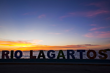 City sign at sunset, Rio Lagartos, Yucatan, Mexico