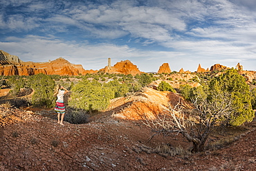 Woman stands barefoot along the Panorama Trail in Kodachrome State Park, Cannonville, Utah, United States of America