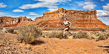 A woman running in the Valley of the Gods, stitched panorama composite, Utah, United States of America