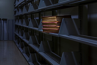 Old books on otherwise empty library bookshelves, Connecticut, United States of America