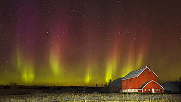 Red barn at night with aurora borealis, Thunder Bay, Ontario, Canada