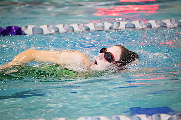 A young woman swimming laps in a lane during a triathalon race, Plano, Texas, United States of America