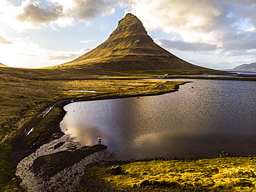 Man observing volcano mountain in Iceland. Image taken with a drone, Grundarfjorour, Iceland