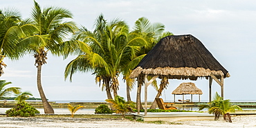 Thatch shelter on a Caribbean beach, Belize