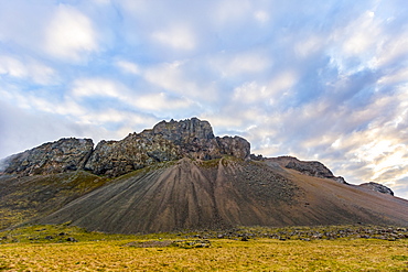 A rugged rocky mountain landscape at sunset in the summer, Iceland