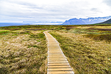 A boardwalk path leads hikers through the hiking route on the Vatnajokull National Park plateau, Iceland