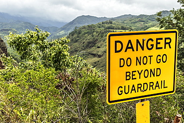 Danger sign at Hanapepe Valley and Canyon Lookout on Kaumualii Highway (Mile 14), also known as Hawaii State Route 50, Kauai, Hawaii, United States of America