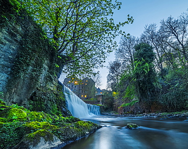 Edinburgh waterfall surrounded by medieval buildings, Edinburgh, Scotland