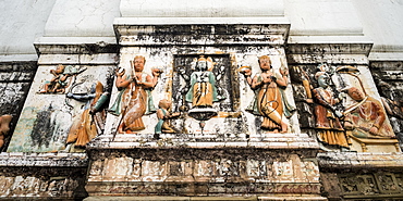 A weathered wall decorated with traditional Indian and Hindu figures, Rishikesh, Uttarakhand, India