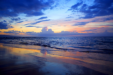 Sunset colours lighting oup clouds and ocean, Wailea, Maui, Hawaii, United States of America