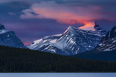 Sunrise illuminating the peaks of the Rocky Mountains over Bow Lake, Banff National Park, Improvement District No. 9, Alberta, Canada