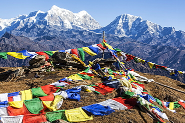 Buddhist prayer flags at the summit of Pikey Peak in the Himalayas, Nepal