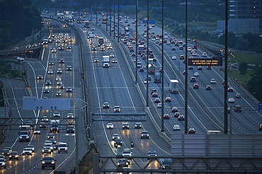 Highway 401 looking West towards Yonge Street at dusk, Toronto, Ontario, Canada