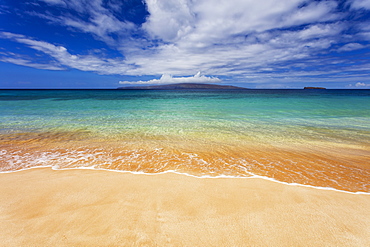 Turquoise ocean water and golden sand on Big Beach, Makena State Park, Makena, Maui, United States of America