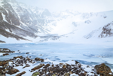 Frozen Hidden Lake and Hidden Peak with snow, Chugach State Park, South-central Alaska, Anchorage, Alaska, United States of America