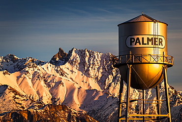 Palmer water tower and Matanuska Peak at sunset in winter, Matanuska Valley, South-central, Palmer, Alaska, United States of America