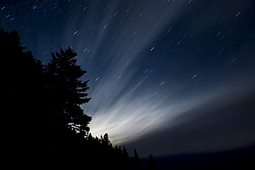 Light streaming through the night sky, The Ovens Natural Park, Nova Scotia, Canada