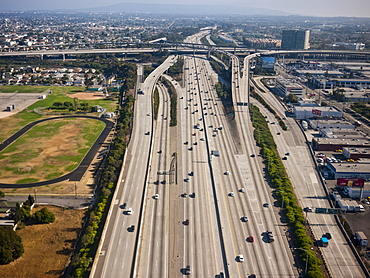 Cityscape showing dense urban areas and roadways with smog in the air, Los Angeles, California, United States of America