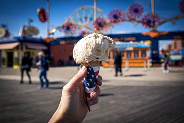 Holding an ice cream cone, Coney Island, Brooklyn, New York, United States of America