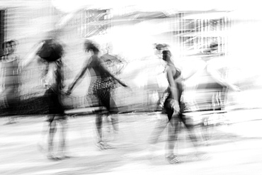 Black and white image of Cuban dance with dancers blurred in motion, Havana, Cuba