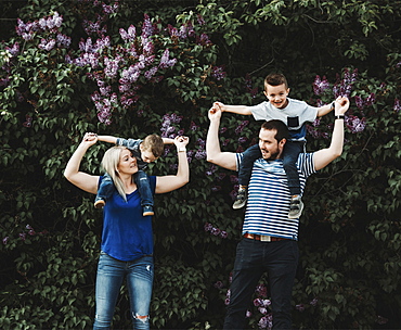 A family with young children playing in a park, Edmonton, Alberta, Canada