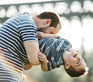 Father plays with his young son, Edmonton, Alberta, Canada