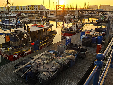 View of Brighton Marina and harbour at sunset, Brighton, East Sussex, England