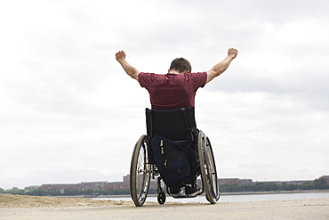 Handicapped man on a wheel chair.