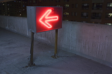 Illuminated arrow sign in a garage, Theater District, Boston, Suffolk County, Massachusetts, USA