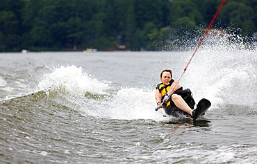 Woman with one leg waterskiing