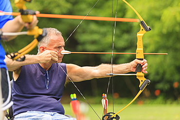 People with disabilities during archery practice