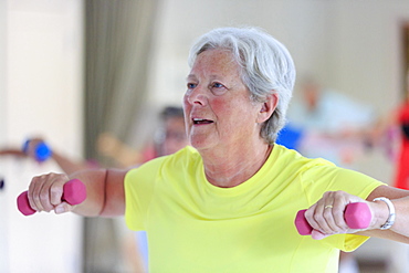 Senior woman exercising in gym