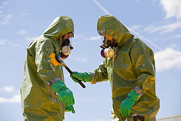 HazMat firefighter getting decontamination wash